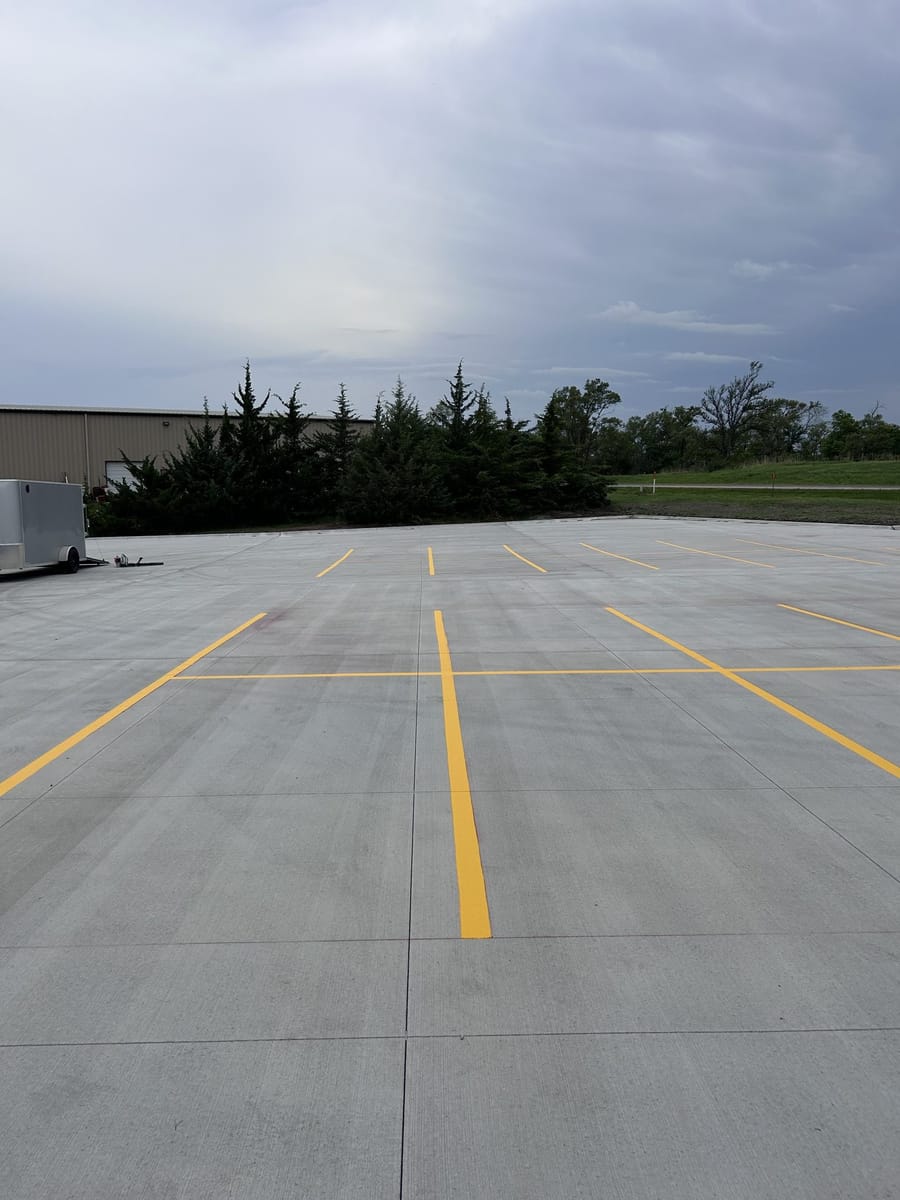 Fresh yellow lines on new concrete
